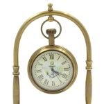 Brass clock on an arch with a compass