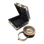 Compass with a magnifying glass in a wooden box