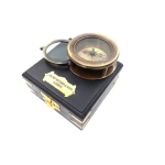 Compass with a magnifying glass in a wooden box