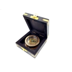 Compass with a magnifying glass in a wooden box
