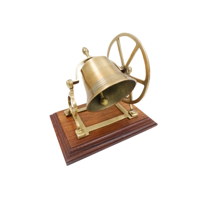 Drehbare Glocke aus Messing auf einem Holzsockel