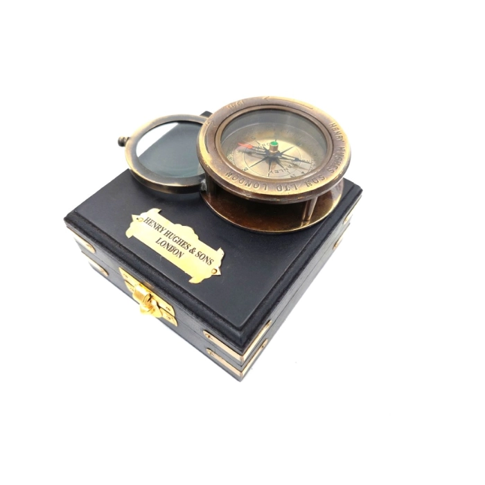 Compass with a magnifying glass in a wooden box